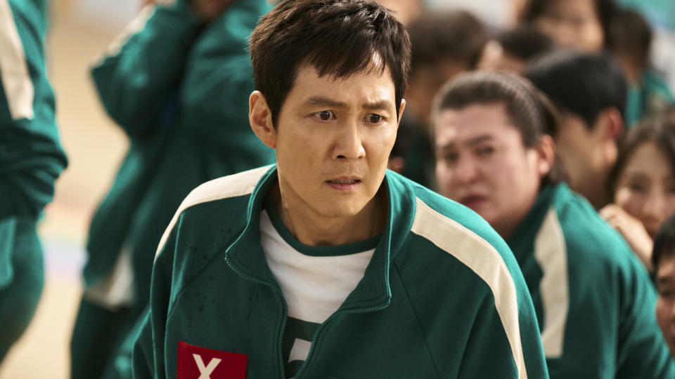  Gi-hun looking scared in Squid Game Season 2. 