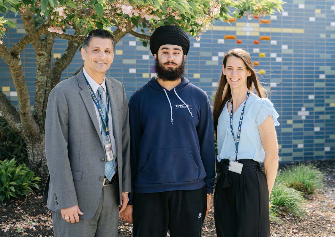 student with principal and teacher