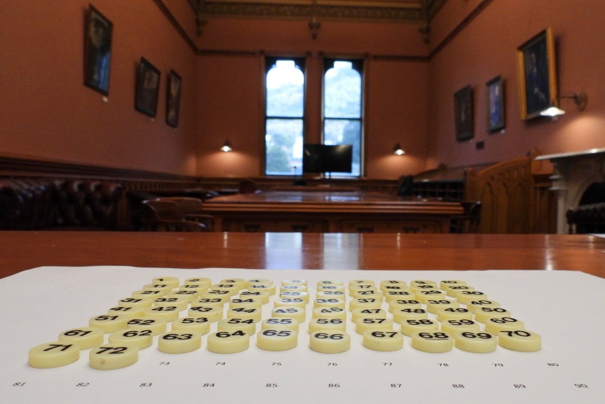 Bingo tokens are shown on a paper in the parliament. 