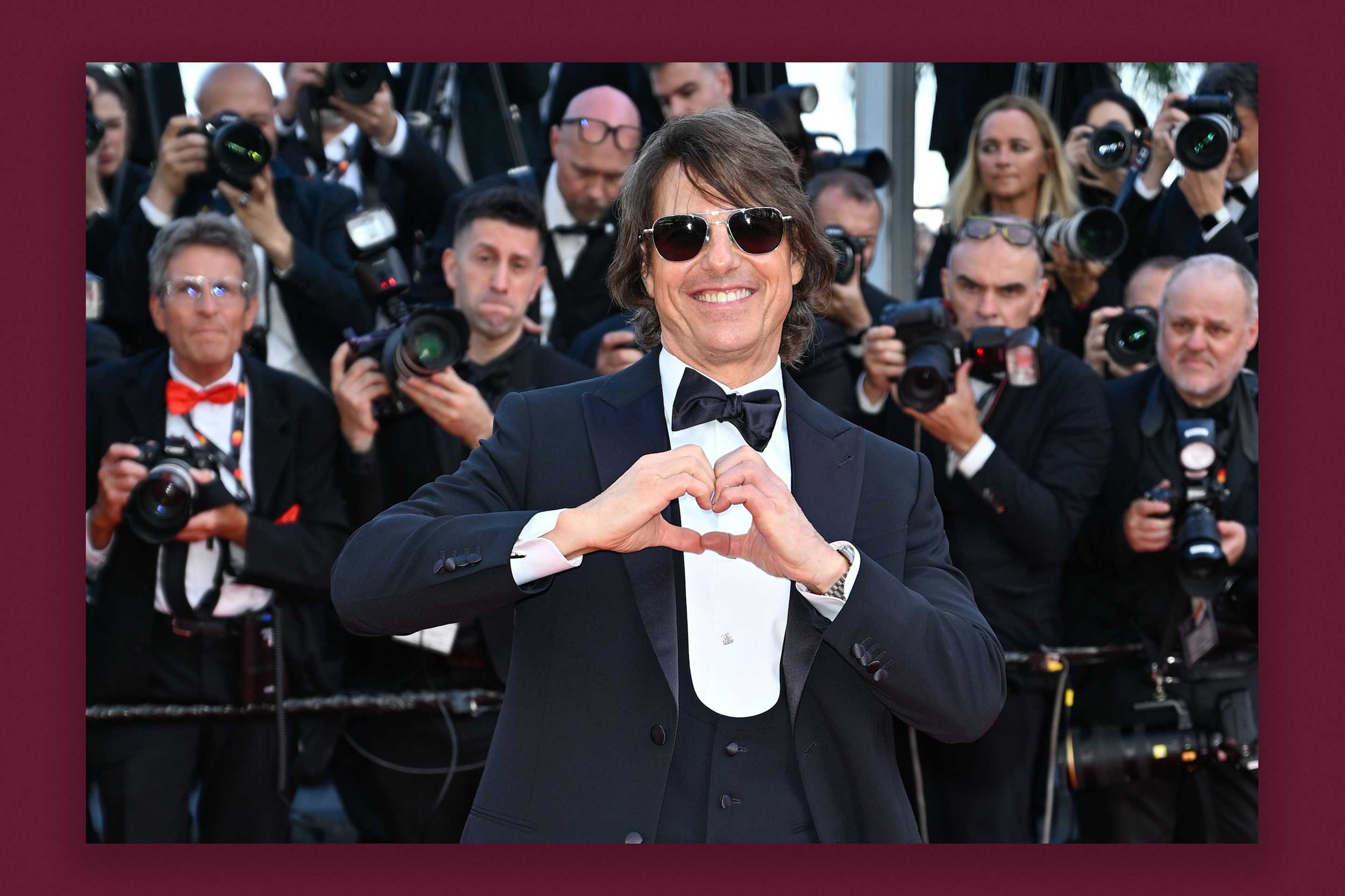 Tom Cruise in front of photographers.