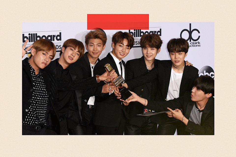 BTS pose with an award