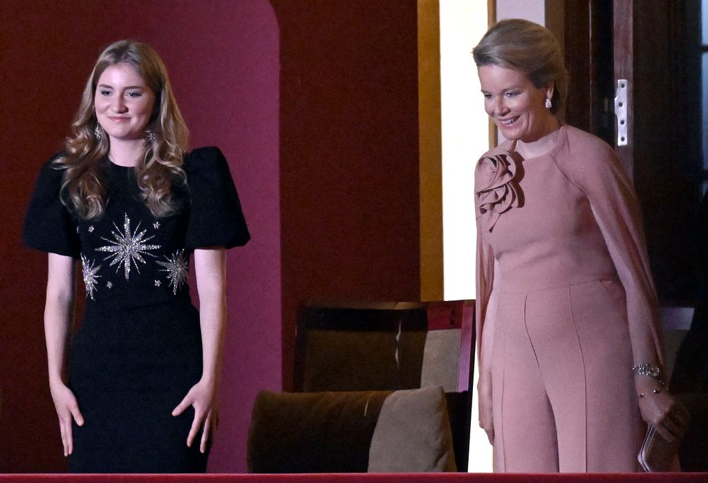 Princess Elisabeth and Queen Mathilde taking their seats at piano competition