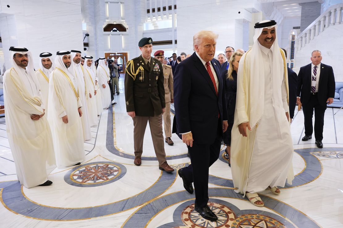 US President Donald Trump walks with Emir of Qatar Tamim bin Hamad al Thani at the Amiri Diwan in Doha, Qatar on May 14.