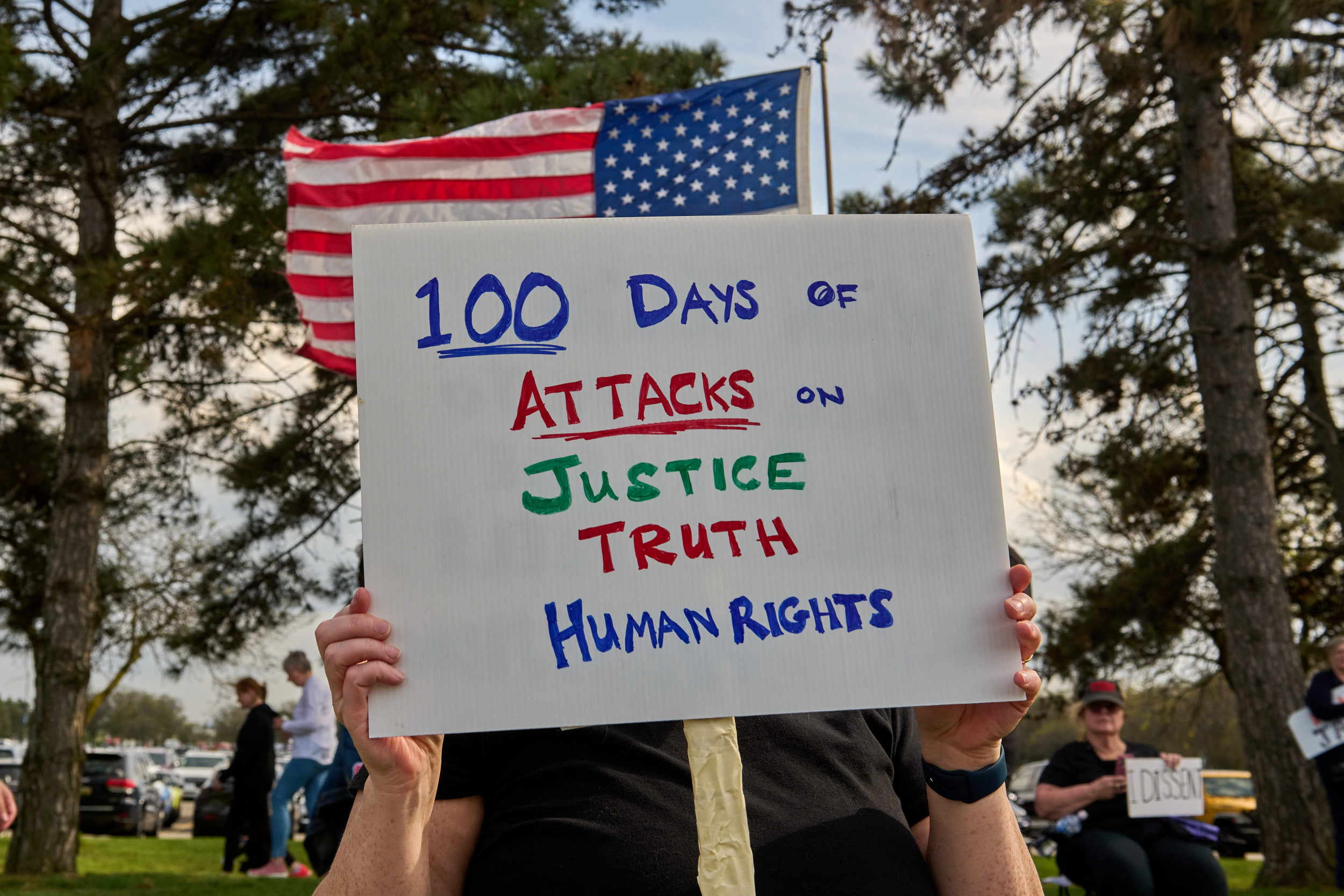 Hundreds protest outside a rally 