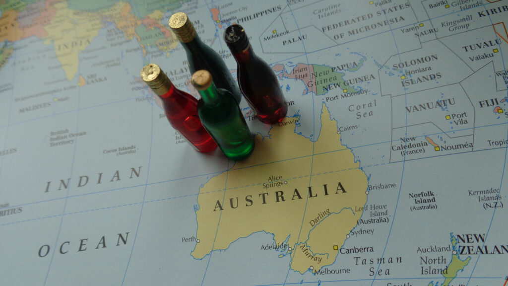 A map of Australia with 4 miniature bottles of wine.Australia’s two largest global wine groups have unveiled new Chief Executive Officers within 24 hours.