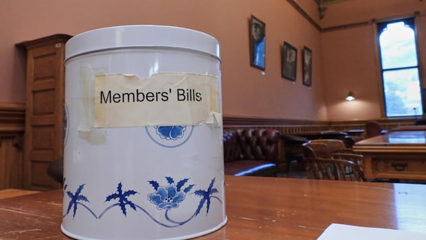 In New Zealand's parliament, a cookie tin holds the power to change laws