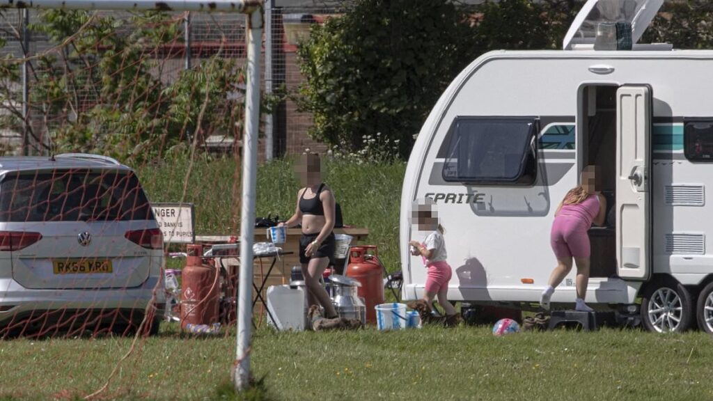 Travellers invade school playing fields forcing furious head teacher to relocate lessons and admit it will be difficult to evict them