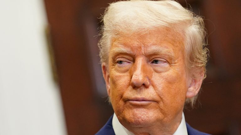 Donald Trump attends in the Roosevelt Room at the White House.
Pic: Reuters
