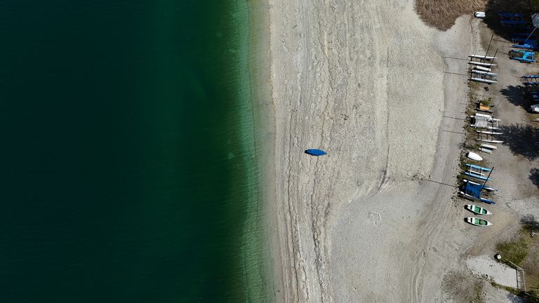 An aerial view shows the gravel bed on the shore of Lake Walchensee due to the low water level near the village of Walchensee, Germany, April 29, 2025. REUTERS/Louisa Off
