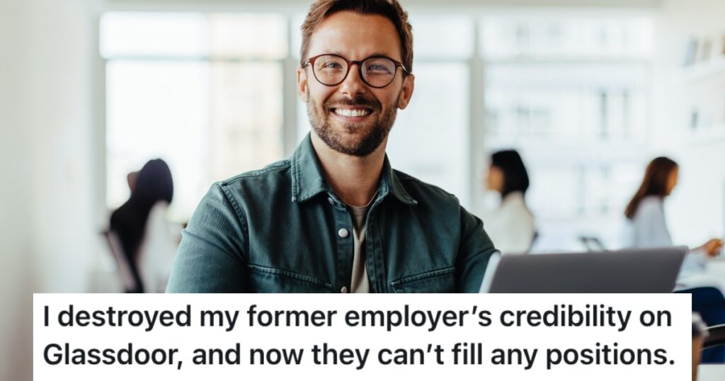 man smiling at his desk