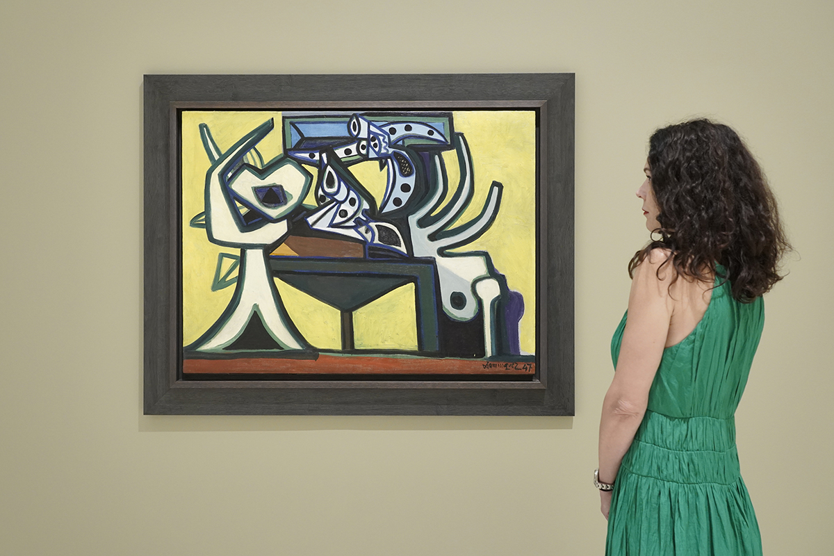Woman viewing an abstract painting.