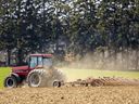 A farmer cultivates a field near Port Stanley on April 10, 2023, where he planned to grow sweet corn. (Mike Hensen/The London Free Press)