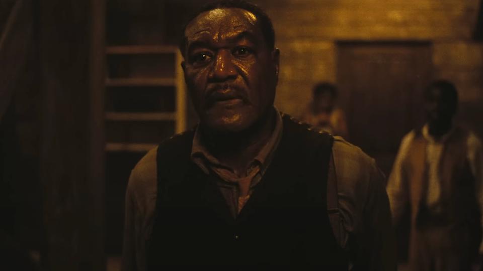 Delroy Lindo stands with a look of disappointment in Sinners.