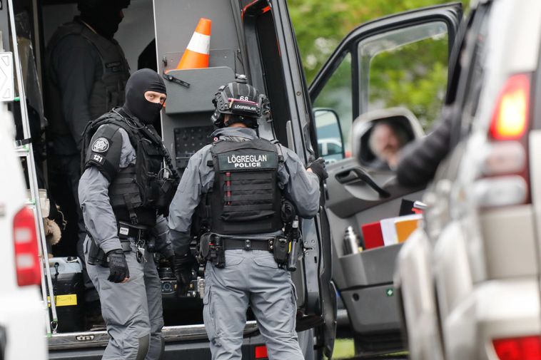 Men arrested after threatening police officer at his home