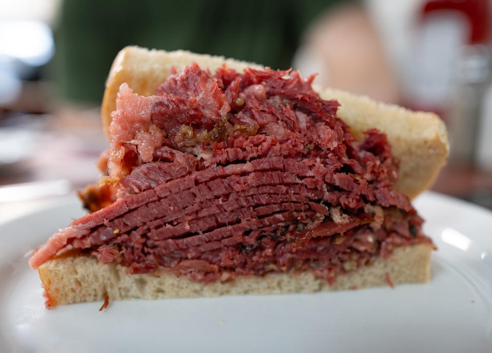 A close up image of a smoked meat sandwich.