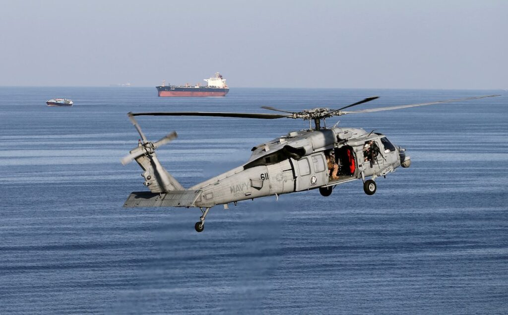 Greece Tells Ships To Reassess Hormuz Journeys After US Strikes Strait of Hormuz tankers and a military helicopter