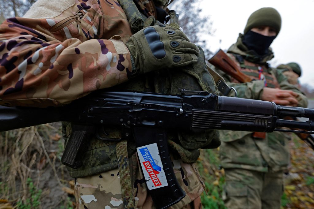Photo: Russian service members stand at a combat position in the course of Russia-Ukraine conflict, on the left bank of the Dnipro river in the Zaporizhzhia region, Russian-controlled Ukraine, November 26, 2022. The sticker reads: "Russia is the future". Credit: REUTERS/Alexander Ermochenko
