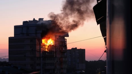 Waves of Russian drones and missiles kill at least 14 people in Kyiv – video