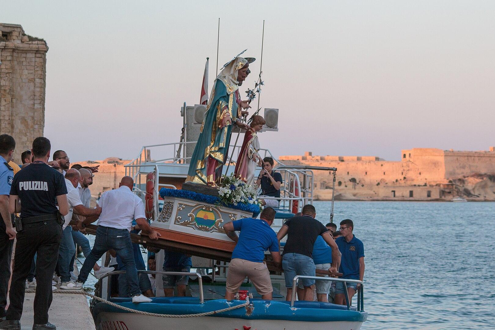 Holy Family statue transported by boat. Photo: Godwin Borg via Wikimedia Commons CC by SA