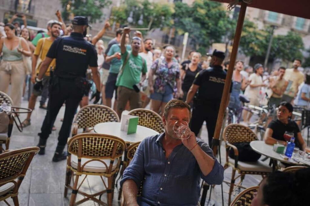 A tourist during an anti-tourist protest in Barcelona yesterday