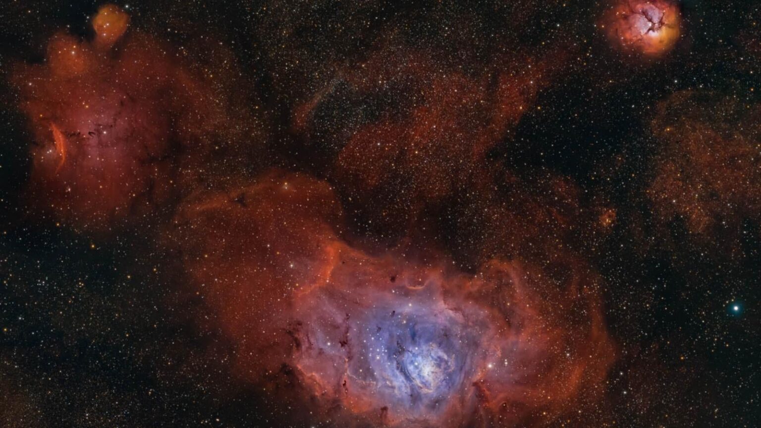 Astrophotographer captures the heart of the Lagoon Nebula glowing below a cosmic Trifid