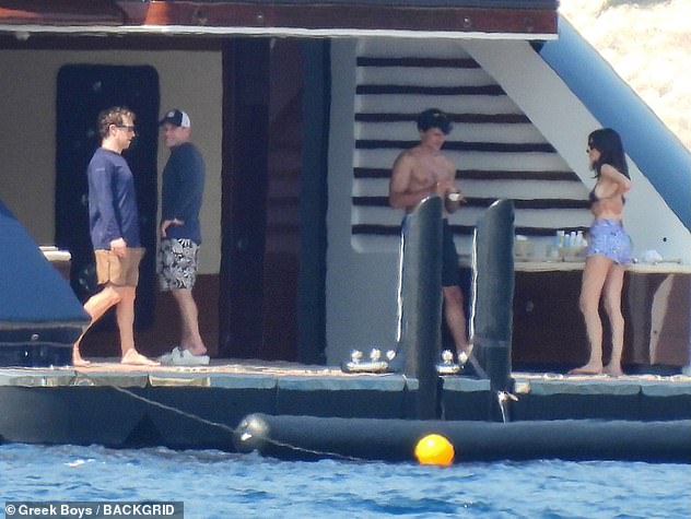 The wealthy businessman looked in good spirits as he took some time off-duty to soak up the sun in the Mediterranean sea
