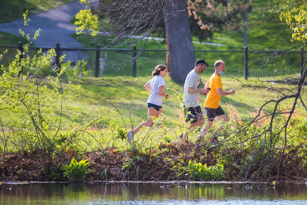Runners along a trail in Roger Williams Park in Providence, R.I.