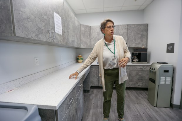 Beth DeDardi gestures to recycled counter tops inside the Luzerne...