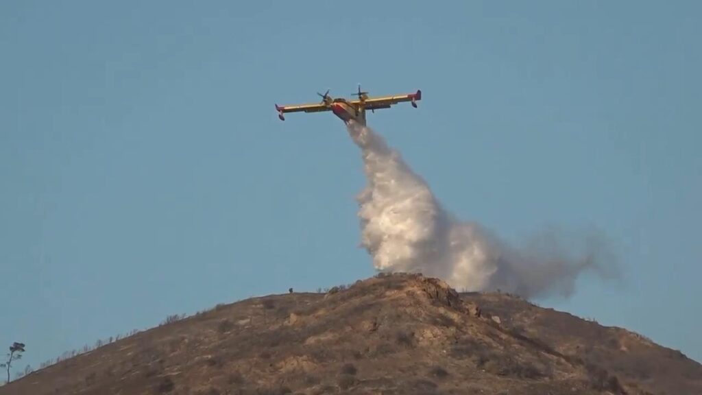 A large wildfire broke out Thursday south of Athens, prompting authorities to send phone alerts urging the evacuation of five communities near the blaze as temperatures approached 40 C (104 F) in Greece&rsquo;s first heat wave of the summer. (AP video by Lefteris Pitarakis, production/Lefteris Pitarakis and Thanassis Stavrakis)