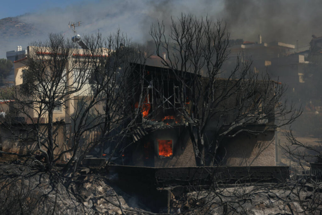 Greece battles wildfire in coastal town near capital Greece battles wildfire in coastal town near capital