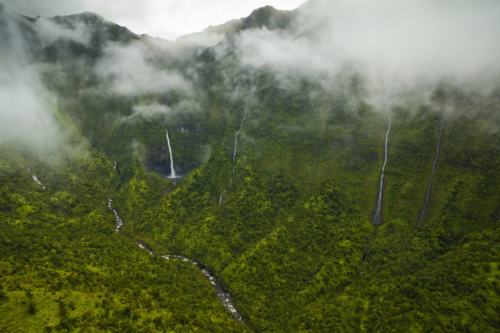 Hinalele Falls (left) and other waterfalls at the head of Wainiha Valley on Kauaʻi. (File Photo Credit: Ethan Welty for The Nature Conservancy)