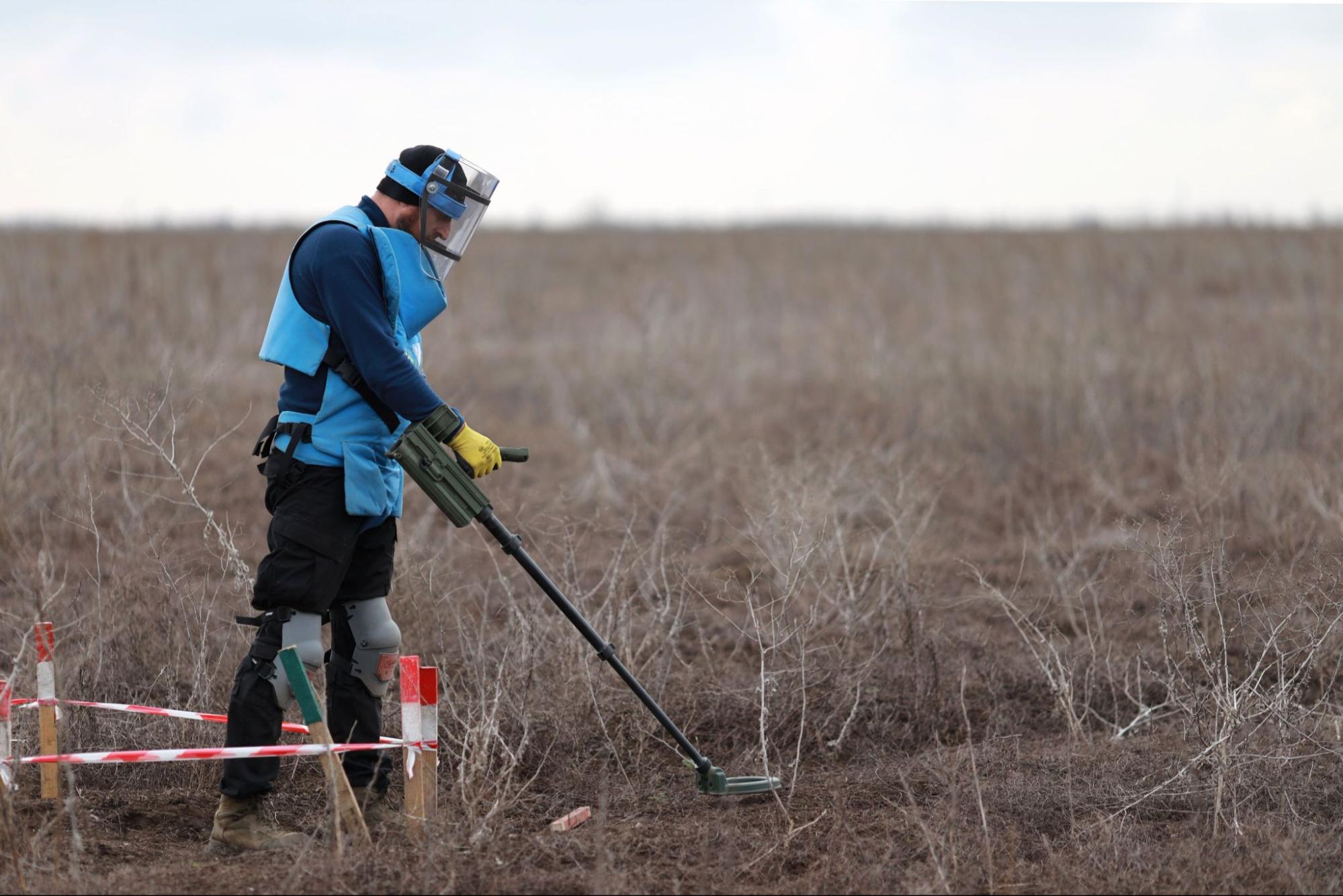 Deminer Oleksandr surveys the minefield in Vavylove, Mykolaiv region