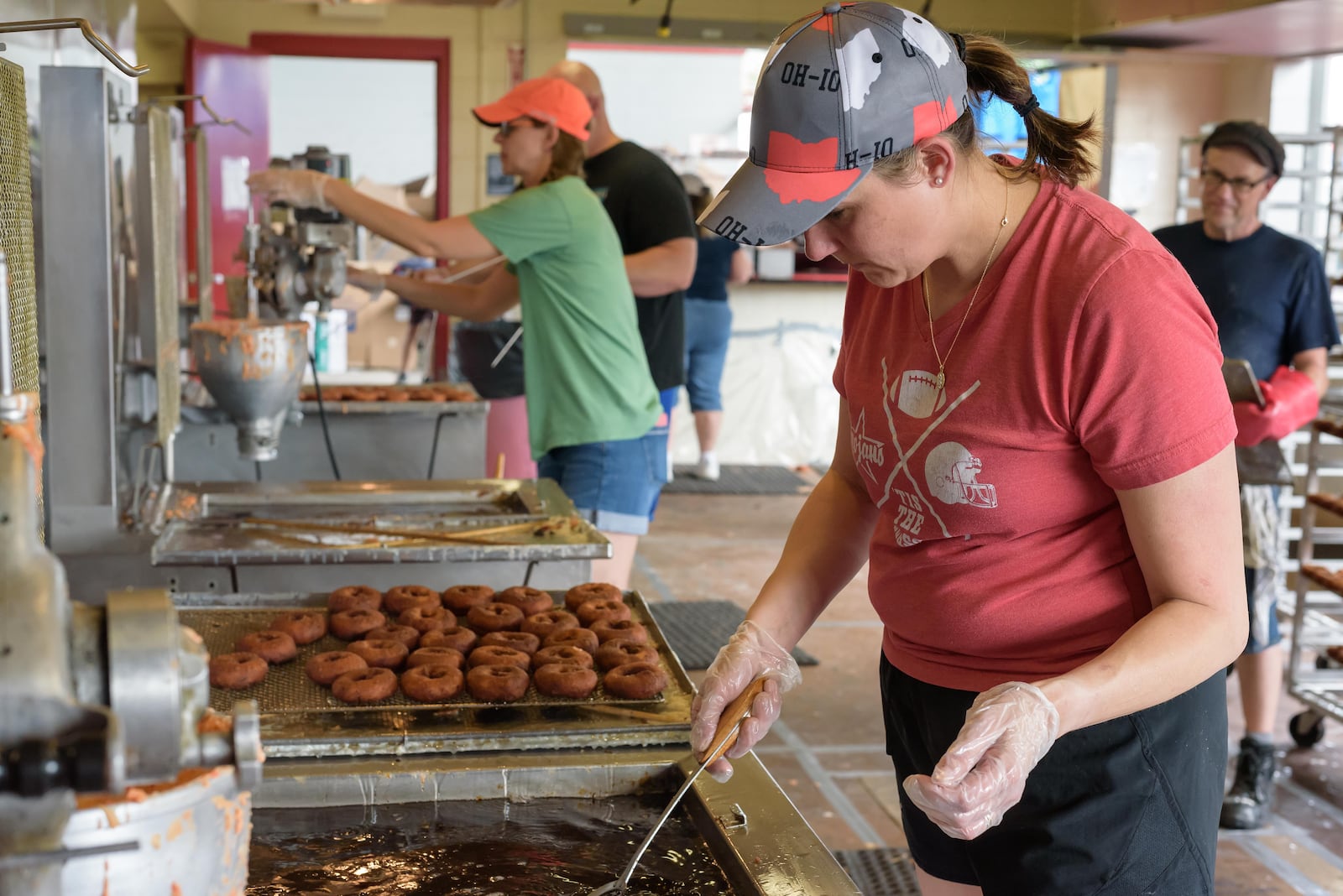 The 48th annual Troy Strawberry Festival took place on Saturday, June 1 and Sunday, June 2, 2024 in downtown Troy and the Great Miami River levee. Featured festivities included strawberry themed foods, vendors, live music and more. Here are scenes from Saturday plus a behind the scenes glimpse at the making of the festival’s famous strawberry donuts by Troy Music Boosters volunteers at Troy Memorial Stadium. This year’s festival theme was Blooming Berries. TOM GILLIAM / CONTRIBUTING PHOTOGRAPHER