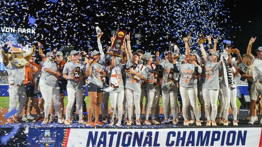 The Texas Longhorns softball team celebrates after defeating Texas Tech 10-4 to win the Women's College World Series championship in Oklahoma City, Friday, June 6, 2025. (AP Photo/Kyle Phillips)