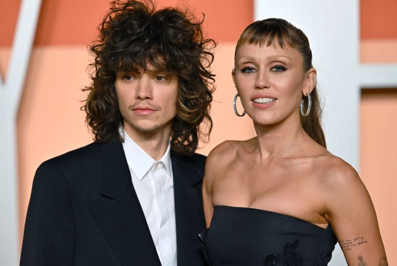 Miley Cyrus and Maxx Morando, seen at the 2025 Vanity Fair Oscar Party in Los Angeles, appear together in "Miley Cyrus: Something Beuatiful." File Photo by Chris Chew/UPI
