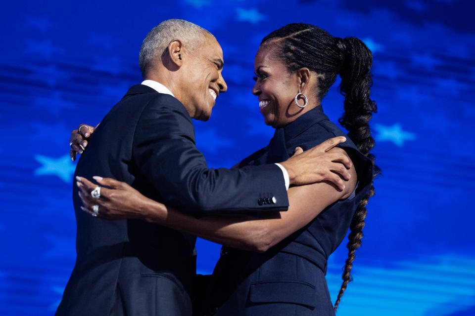 UNITED STATES - AUGUST 20: Former President Barack Obama and former first lady Michelle Obama appear on stage in between their addresses on the second night of the Democratic National Convention at the United Center in Chicago, Ill., on Tuesday, August 20, 2024. (Tom Williams/CQ-Roll Call, Inc via Getty Images)