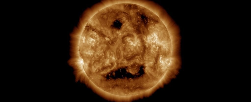 A giant mouth-like hole in the Sun about as wide as five Jupiters is blasting hot Sun breath in Earth's general direction