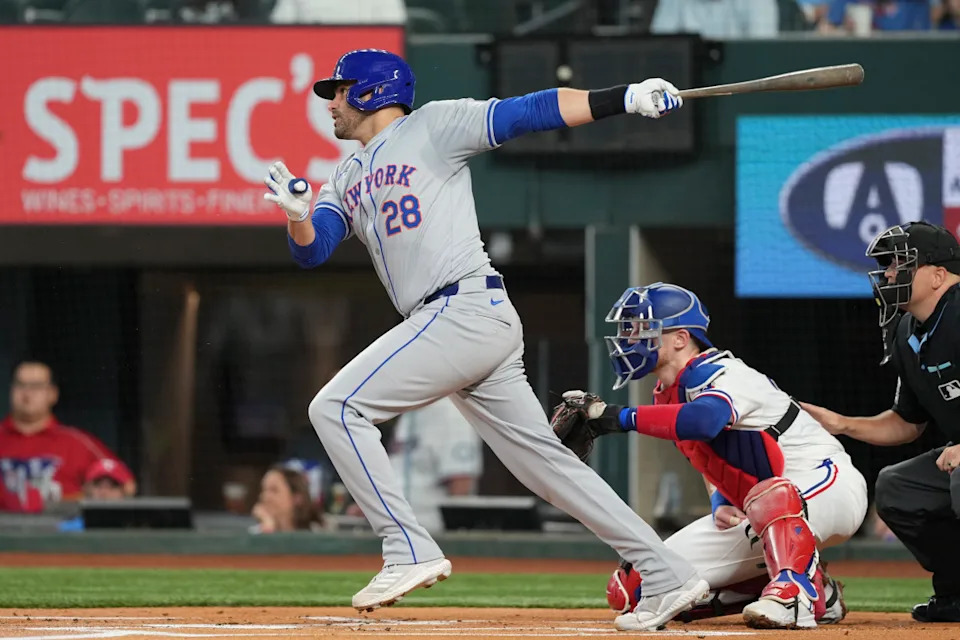 Jun 17, 2024; Arlington, Texas, USA; New York Mets designated hitter J.D. Martinez (28) follows through on his single against the Texas Rangers during the first inning at Globe Life Field.© Jim Cowsert-Imagn Images