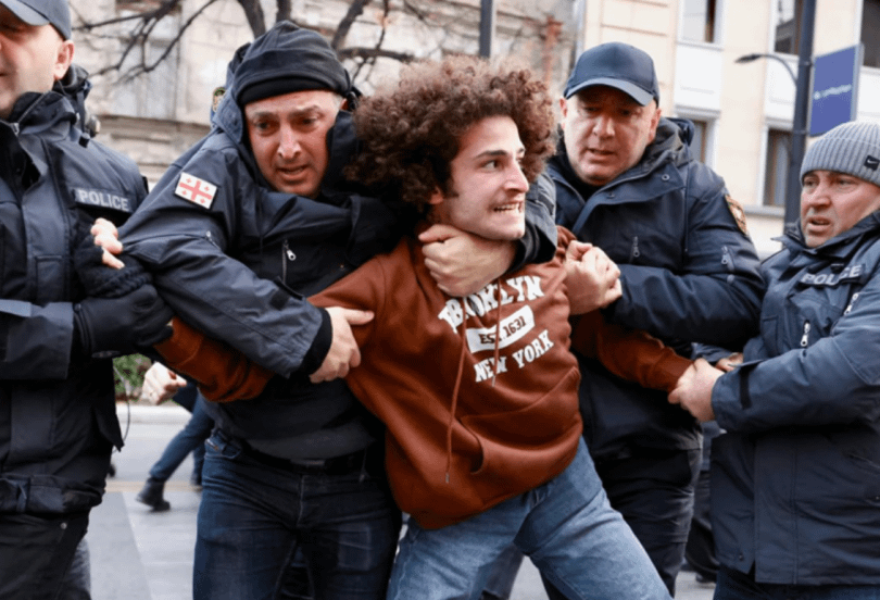 “Searching for light in total darkness” — these were the words of 21-year-old Mate Devidze as he left the courtroom, just before being sentenced to 4 years and 6 months in prison for “assaulting police officers” during the pro-EU protests