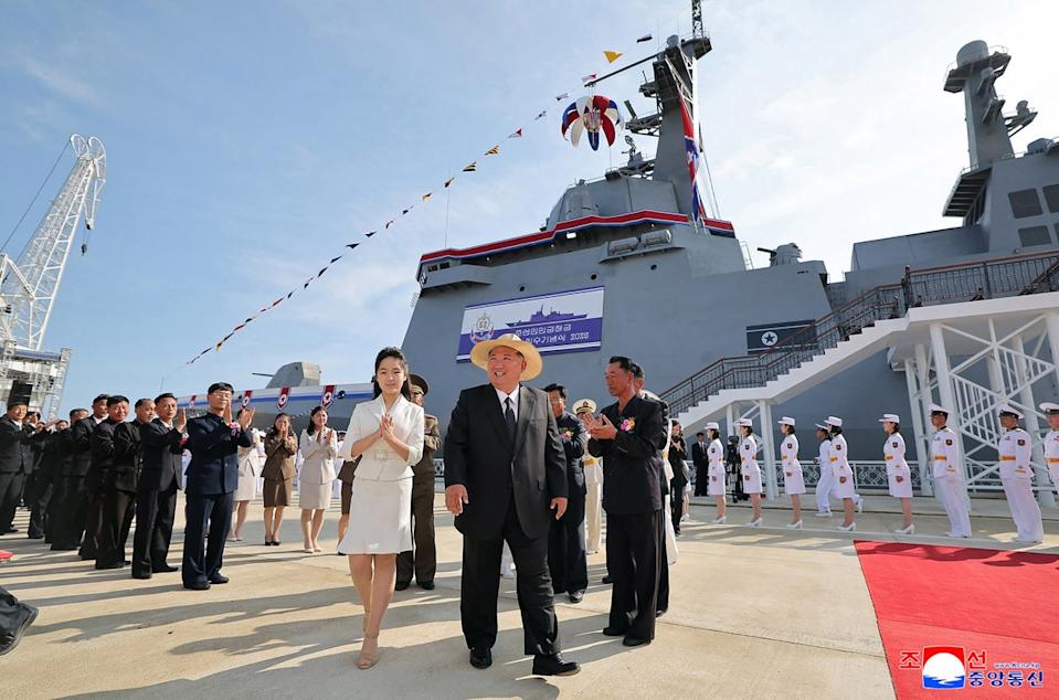 North Korea's leader Kim Jong Un (C) and his daughter Ju Ae (centre L) attending the launch ceremony for the 'Kang Kon' at the Rajin shipyard at the port near Rason (KCNA VIA KNS/AFP via Getty Images)
