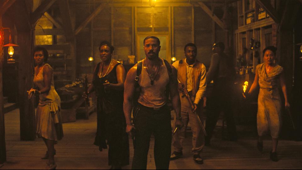 Michael B Jordan stands ready for battle with his fellow cast members in Sinners. 
