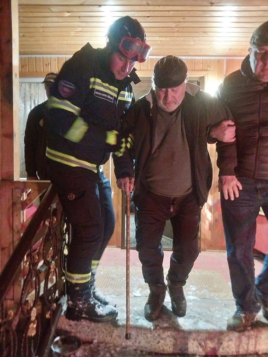 Firefighters help a Gurian resident to safety. Source: Ozurgeti City Hall