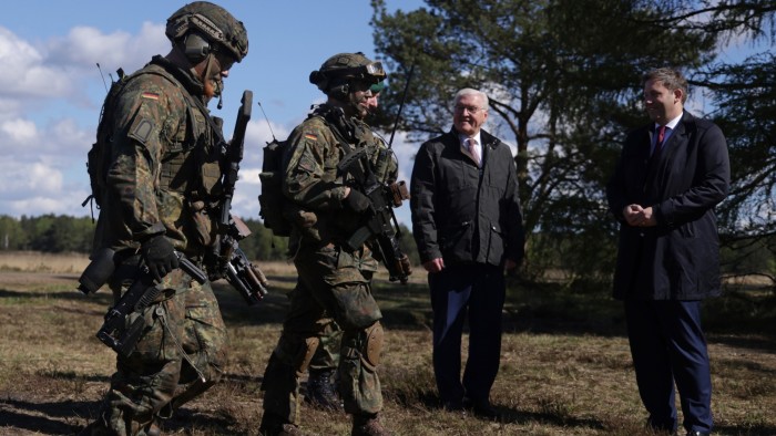 German President Frank-Walter Steinmeier, centre, and Lars Klingbeil, co-head of the German Social Democrats visit a military exercise