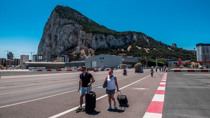 UK to let Spain check Gibraltar passports in deal with EU Two tourists cross the border to leave Gibraltar and enter Spain
