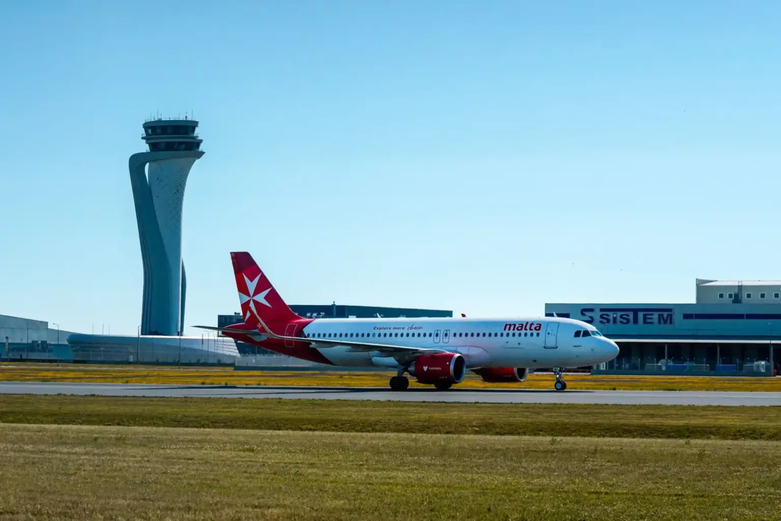 KM Malta Airlines Airbus A320 taxiing at Istanbul Airport with control tower in background