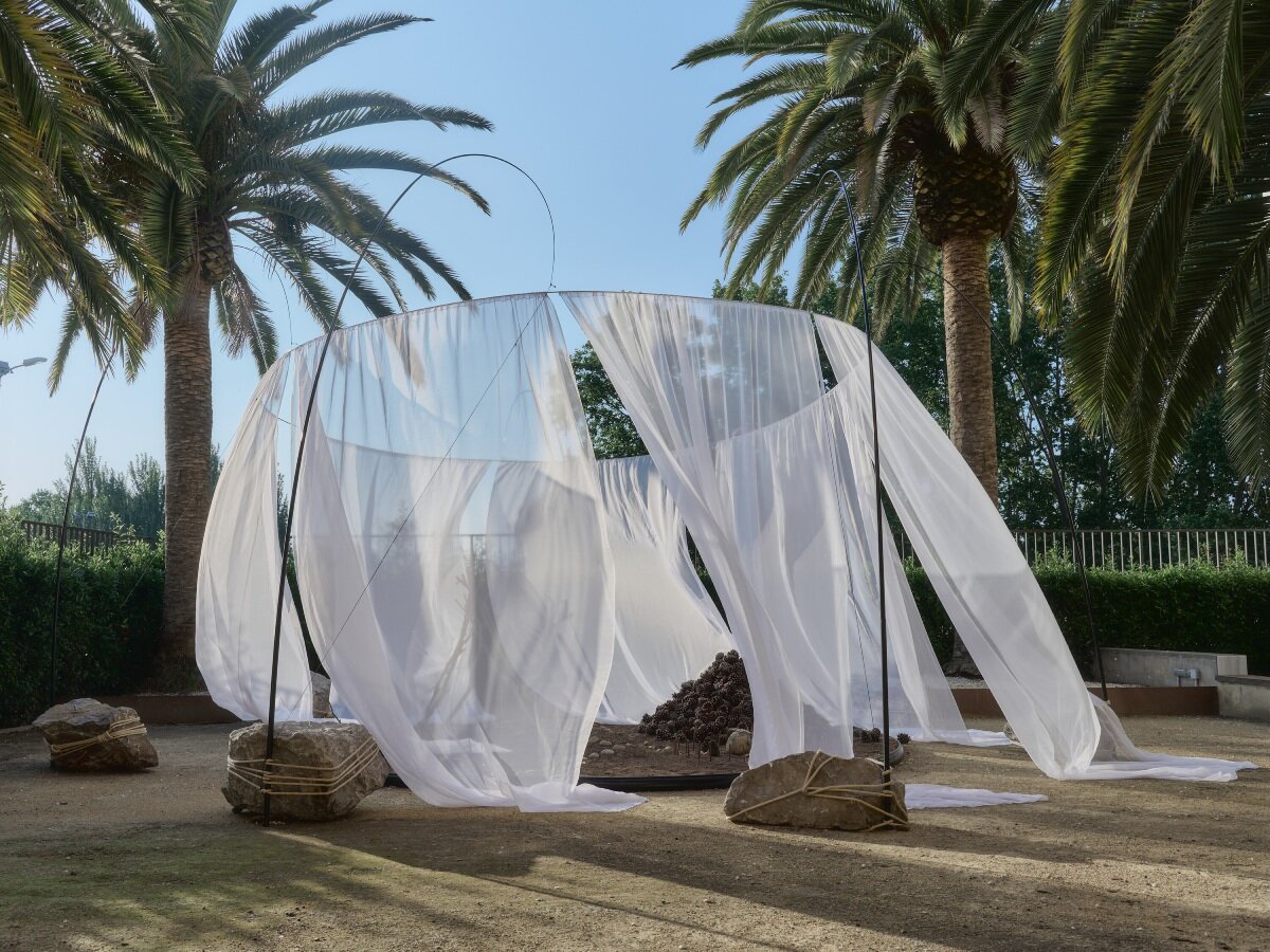translucent drapes encircle forest floor for nami nami's concéntrico installation in spain