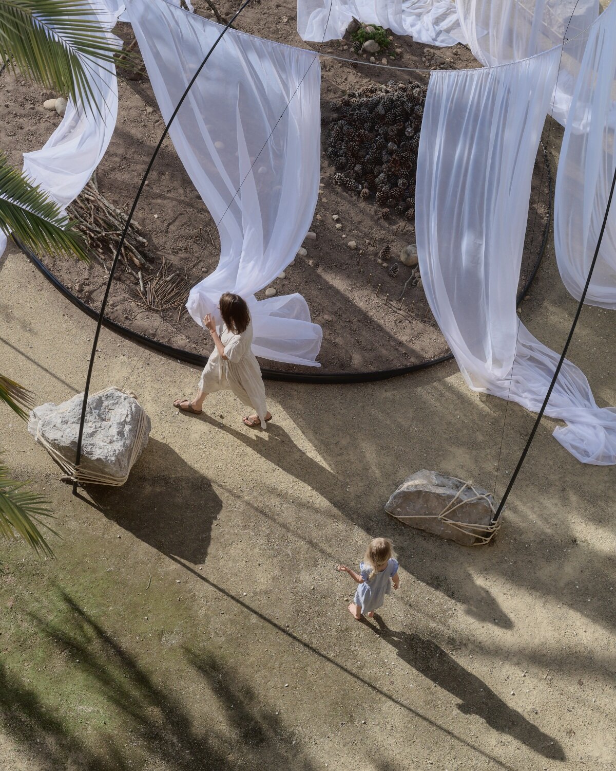 translucent drapes encircle forest floor for nami nami's concéntrico installation in spain