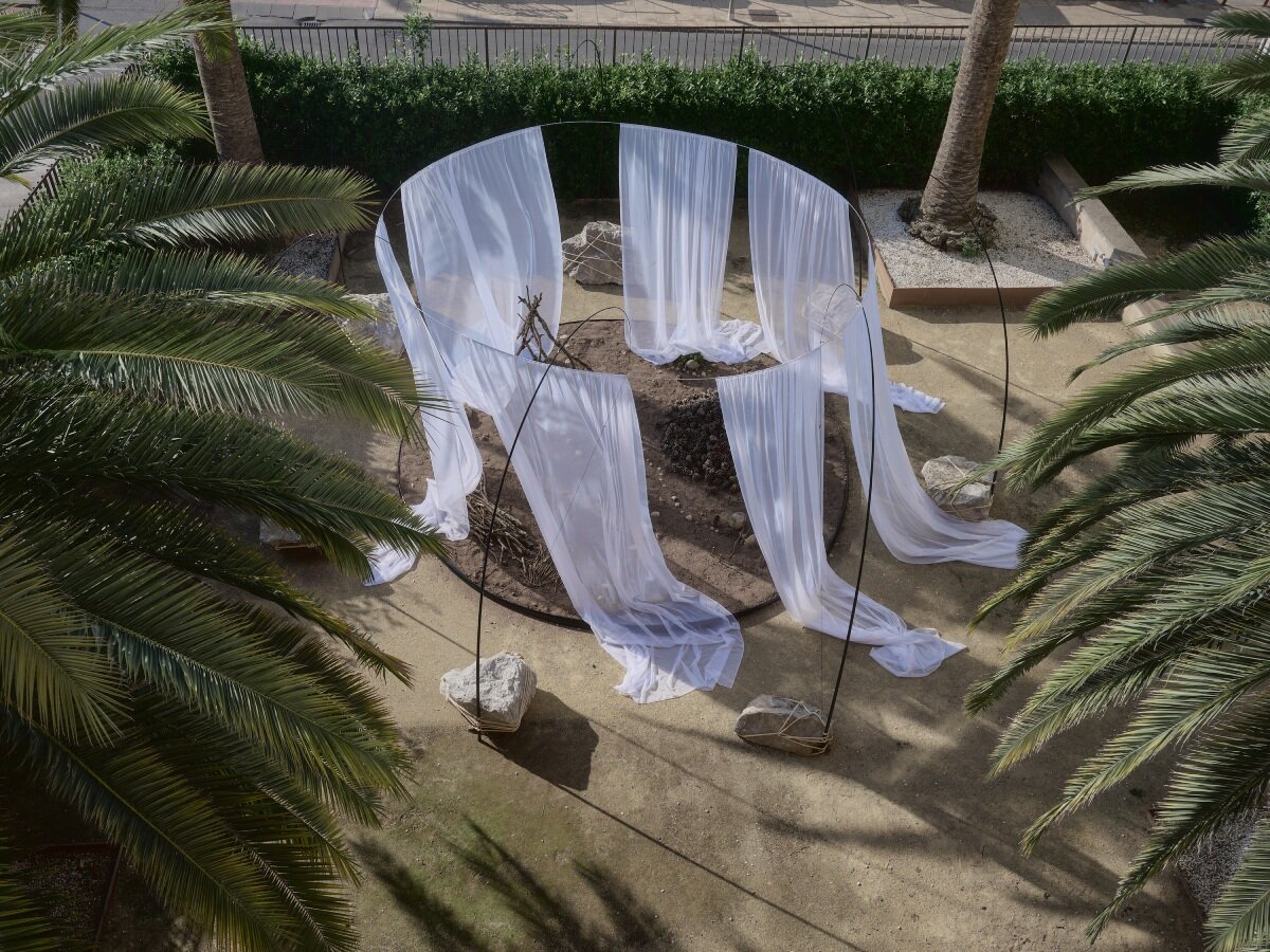 translucent drapes encircle forest floor for nami nami's concéntrico installation in spain