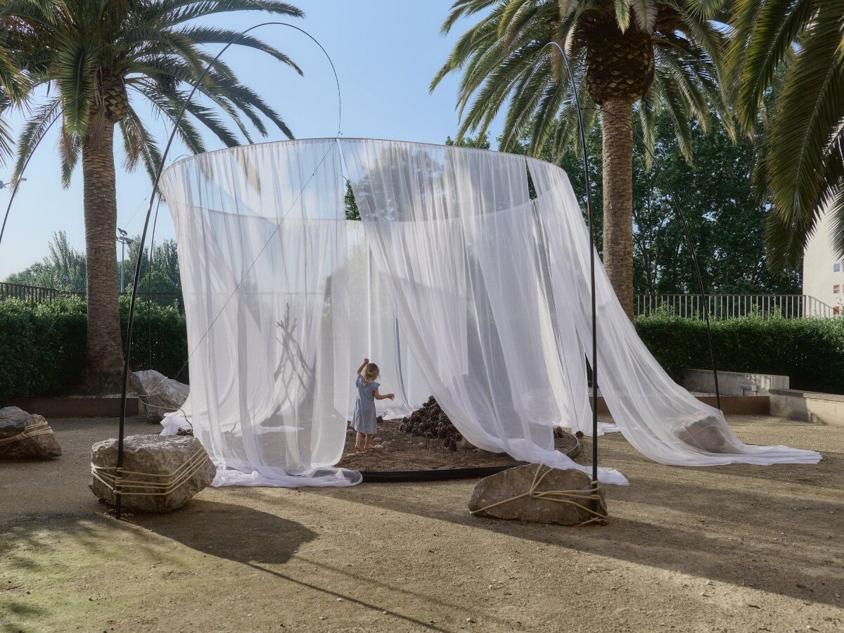 translucent drapes encircle forest floor for nami nami's concéntrico installation in spain