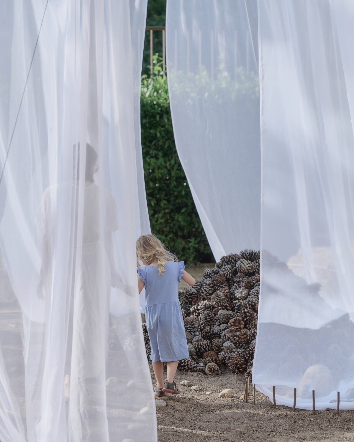 translucent drapes encircle forest floor for nami nami's concéntrico installation in spain